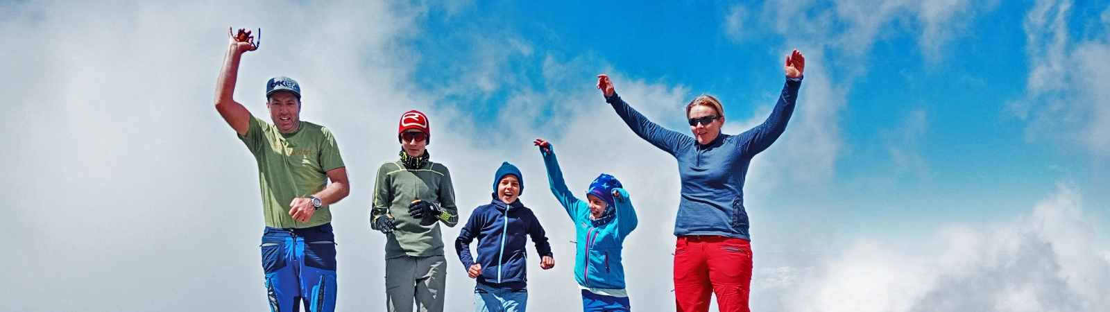 Climbers enjoy on the top of the famous Barranco Wall on the 7-day Machame route trek.