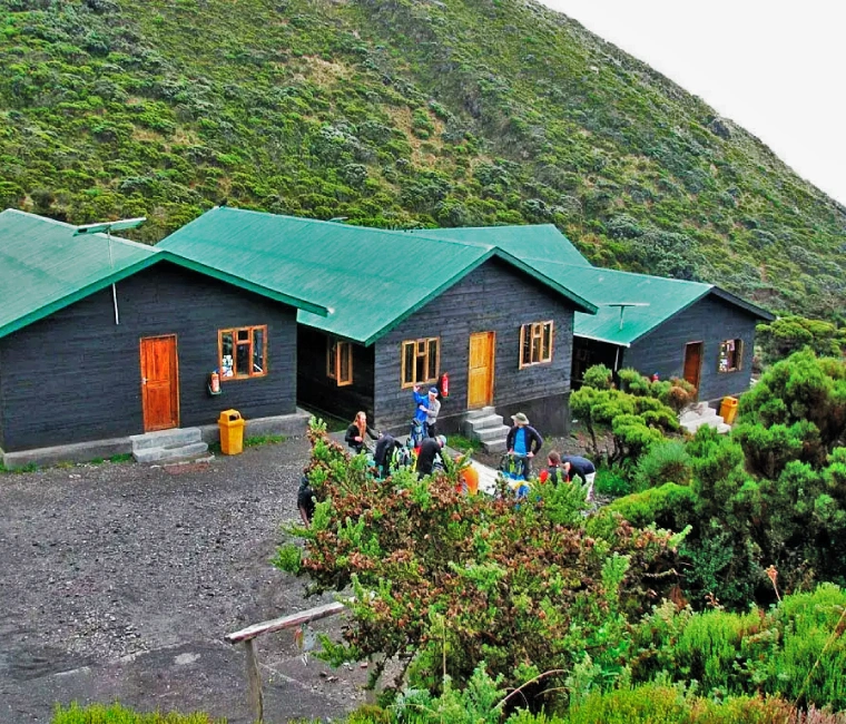 Mount Meru rising above Arusha National Park, a popular destination for hiking and wildlife experiences.